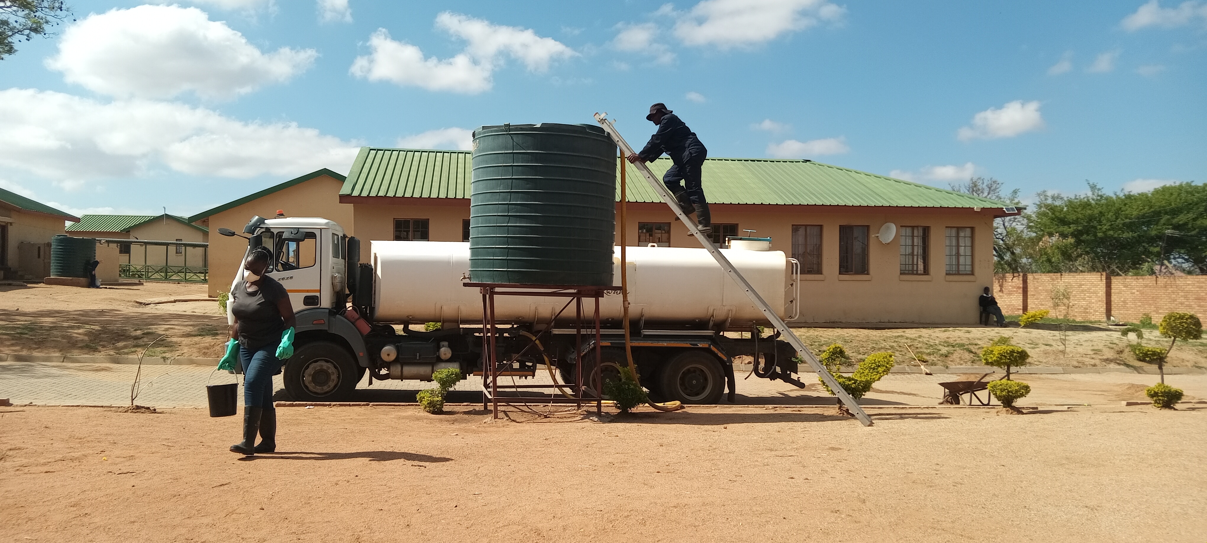 PICTURE 7_A worker fetching water from the water tank. Picture by Vicky Abraham.
